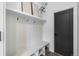 Contemporary mudroom features built-in bench seating, storage cubbies, and a sleek black door at 535 Josephine St, Denver, CO 80206