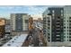 Modern high-rise apartment buildings along a street with parked cars, offering convenient urban living at 535 Josephine St, Denver, CO 80206