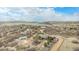 Aerial view of the home, outbuilding, and driveway nestled in a mountainous landscape at 5774 Sioux Dr, Sedalia, CO 80135