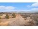 Fenced yard featuring a small shed, trees, and a tranquil mountain view at 5774 Sioux Dr, Sedalia, CO 80135