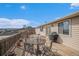 Inviting outdoor deck featuring stylish metal furniture and scenic views at 5774 Sioux Dr, Sedalia, CO 80135