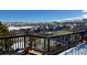 Mountain view from deck with winter landscape and snow-covered hills at 5774 Sioux Dr, Sedalia, CO 80135