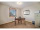 Comfortable office space featuring a desk, chair, natural light, and carpeted floors for a productive workspace at 5774 Sioux Dr, Sedalia, CO 80135