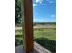 Idyllic view from the porch with a grassy yard and blue skies at 5774 Sioux Dr, Sedalia, CO 80135