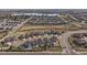 Aerial view of a neighborhood with a lake and well-maintained homes and landscaping at 6747 W Jewell Pl, Lakewood, CO 80227