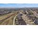 Expansive aerial view of a Primary-planned community with mountain views at 6747 W Jewell Pl, Lakewood, CO 80227