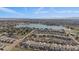Aerial shot of lakeside homes with a picturesque lake and lush greenery at 6747 W Jewell Pl, Lakewood, CO 80227