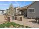 Backyard grilling area featuring a built-in grill, countertop, and outdoor seating perfect for entertaining at 6747 W Jewell Pl, Lakewood, CO 80227