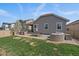 Outdoor backyard featuring a built-in grill, dining area, and outdoor seating, perfect for relaxation at 6747 W Jewell Pl, Lakewood, CO 80227