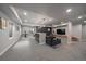 Finished basement with a bar and a TV area at 6747 W Jewell Pl, Lakewood, CO 80227
