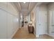 Hallway boasting wood floors, recessed lights, wainscotting, and a view to the rest of the house at 6747 W Jewell Pl, Lakewood, CO 80227
