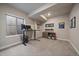 Functional home office setup with a sit-stand desk, dual monitors, and ample space for productivity at 6747 W Jewell Pl, Lakewood, CO 80227