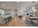 Open concept floor plan with sight lines to kitchen, dining area, living room, and hallway at 6747 W Jewell Pl, Lakewood, CO 80227