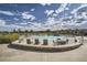 Resort-style community pool with ample seating and beautiful landscaping at 6747 W Jewell Pl, Lakewood, CO 80227