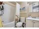 Clean bathroom with a shower/tub combo and white vanity at 7373 W Florida Ave # 10G, Lakewood, CO 80232