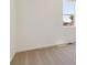 Bright bedroom featuring tan carpet, white walls, baseboard trim and a window at 2256 Base St, Fort Lupton, CO 80621
