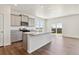 Modern kitchen features granite countertops, gray cabinets, stainless steel appliances, and a central island at 2256 Base St, Fort Lupton, CO 80621