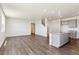 Open-concept living room seamlessly connects to a modern kitchen with lots of natural light at 2256 Base St, Fort Lupton, CO 80621