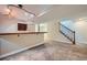 Finished basement featuring carpeted flooring, bar, and staircase at 15835 E Oxford Ave, Aurora, CO 80013