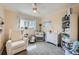 Bright Bedroom with carpet, ceiling fan, changing table, and storage at 15835 E Oxford Ave, Aurora, CO 80013