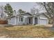 Charming single-Gathering home showcasing a well-maintained front yard, bay window, and stucco exterior at 15835 E Oxford Ave, Aurora, CO 80013