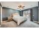 Bedroom with neutral carpet, ceiling fan, and sliding glass door to the backyard at 15835 E Oxford Ave, Aurora, CO 80013