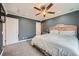 Spacious bedroom with neutral carpet, ceiling fan, and plenty of closet space at 15835 E Oxford Ave, Aurora, CO 80013