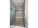 Large walk-in shower with glass enclosure and built-in seat at 8305 Parkland St, Broomfield, CO 80021