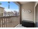 Outdoor balcony with a view, privacy fencing, and storage box at 9961 E Idaho Cir # 104, Aurora, CO 80247