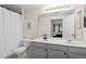Bathroom featuring dual sinks, a large mirror, and a shower-tub combination at 9961 E Idaho Cir # 104, Aurora, CO 80247