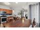 Open kitchen with stainless steel appliances and a dining area with natural light at 9961 E Idaho Cir # 104, Aurora, CO 80247