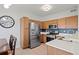 Modern kitchen with stainless steel appliances, a gas stove, and ample counter space at 9961 E Idaho Cir # 104, Aurora, CO 80247