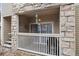 Enclosed patio area featuring stone accents, a wind chime and sliding glass doors to the interior at 9961 E Idaho Cir # 104, Aurora, CO 80247