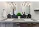 Modern bathroom featuring a double vanity with stylish lighting and geometric backsplash at 427 Whispering Pines Cir, Breckenridge, CO 80424