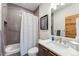 Well-designed bathroom with gray tile, a sleek vanity, and a combination tub and shower at 427 Whispering Pines Cir, Breckenridge, CO 80424