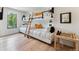 Unique bunk beds with a wooden ladder, complemented by light hardwood floors and decor at 427 Whispering Pines Cir, Breckenridge, CO 80424