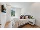 Bright bedroom featuring a plush bed with decorative pillows and scenic outdoor views at 427 Whispering Pines Cir, Breckenridge, CO 80424
