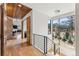 Bright foyer with hardwood floors, wooden ceiling accents, and modern staircase with mountain view at 427 Whispering Pines Cir, Breckenridge, CO 80424