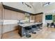 Modern kitchen island with breakfast bar seating and high ceilings at 427 Whispering Pines Cir, Breckenridge, CO 80424