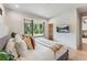 Main bedroom with a scenic backyard view through a large window, and wall-mounted TV at 427 Whispering Pines Cir, Breckenridge, CO 80424