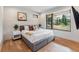 Main bedroom with large window offering scenic outdoor views and plush bedding at 427 Whispering Pines Cir, Breckenridge, CO 80424
