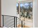 Modern staircase with mountain view windows, bringing natural light and scenery indoors at 427 Whispering Pines Cir, Breckenridge, CO 80424