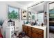 Bright bathroom with a large mirror, double sinks, vanity, and decor at 214 Poppy St, Golden, CO 80401