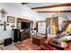 Inviting living room features exposed beam ceiling and modern decor, perfect for relaxing or entertaining guests at 214 Poppy St, Golden, CO 80401
