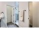 Bathroom featuring modern gray tile flooring and a glass-enclosed shower at 10151 W 38Th Ave, Wheat Ridge, CO 80033