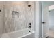 Bathtub with white subway tile and black fixtures at 10151 W 38Th Ave, Wheat Ridge, CO 80033