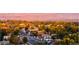 Panoramic cityscape with rooftops, trees, streets and mountains in the background at 10151 W 38Th Ave, Wheat Ridge, CO 80033