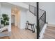 Welcoming entryway with modern staircase, light wood floors, and stylish decor at 10151 W 38Th Ave, Wheat Ridge, CO 80033