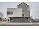 Modern townhome with geometric design, large windows, and a sleek color scheme at 10151 W 38Th Ave, Wheat Ridge, CO 80033