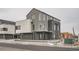 Contemporary grey townhome with unique architecture and clean, modern lines at 10151 W 38Th Ave, Wheat Ridge, CO 80033